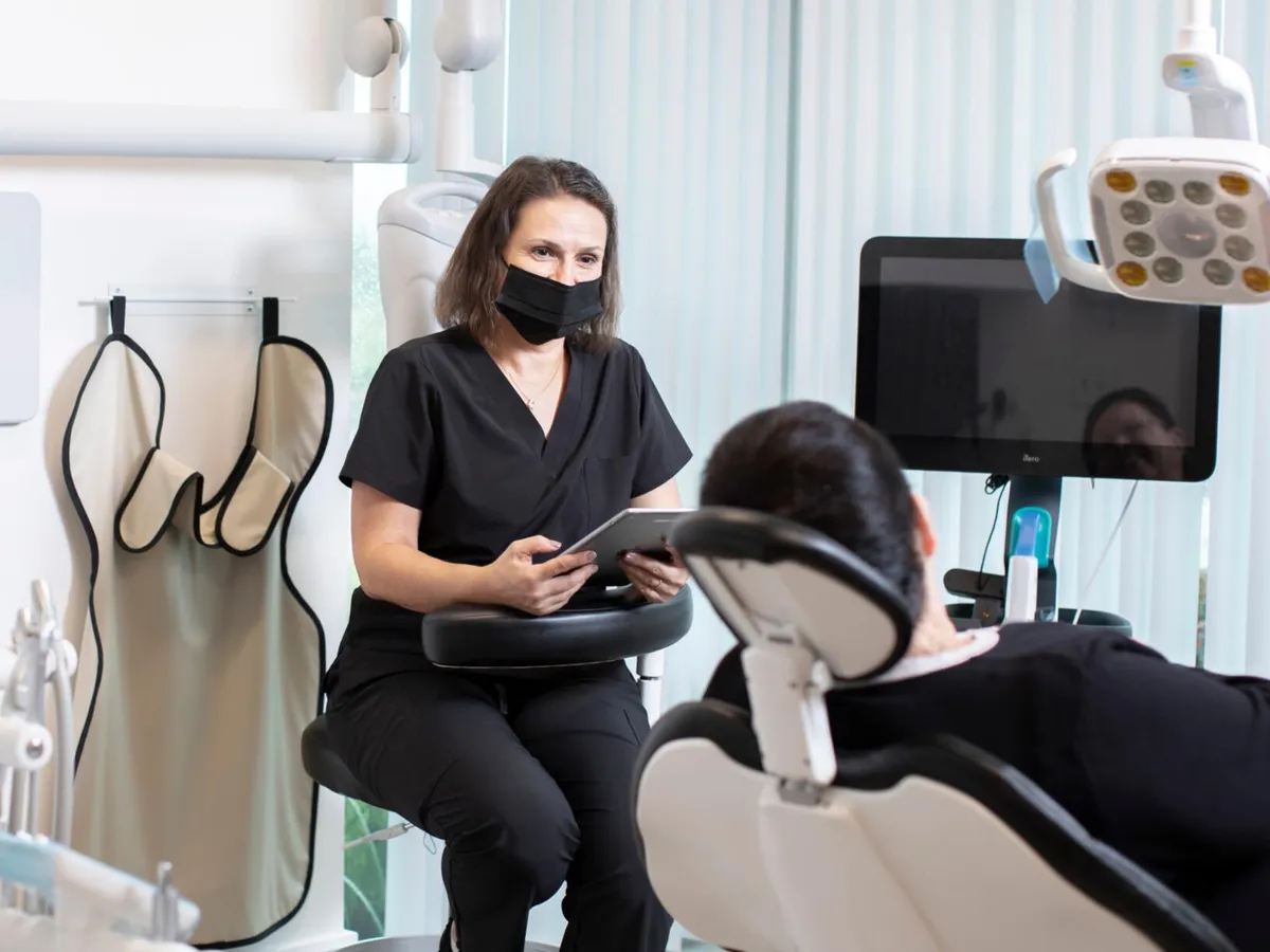 Patient consultation about affordable dental implant pricing